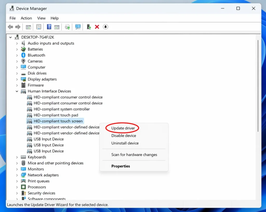 Screenshot of Windows Device Manager showing Human Interface Devices category expanded with touchscreen driver and right-click menu highlighting update driver option