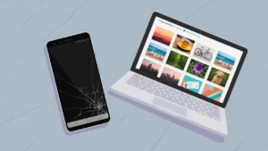 Cracked Android phone next to a laptop showing recovered photos, illustrating how to extract photos from a damaged Android phone